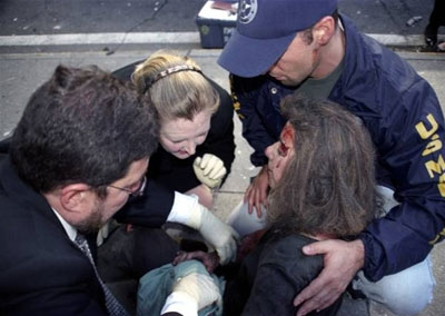 An injured woman receives assistance