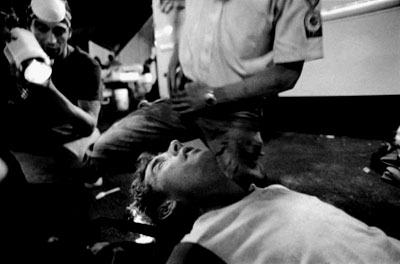 An injured man receives treatment